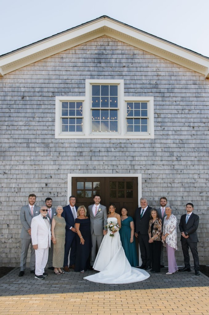 Ash point estate boothbay harbor, wedding party stands in front of ash point estate