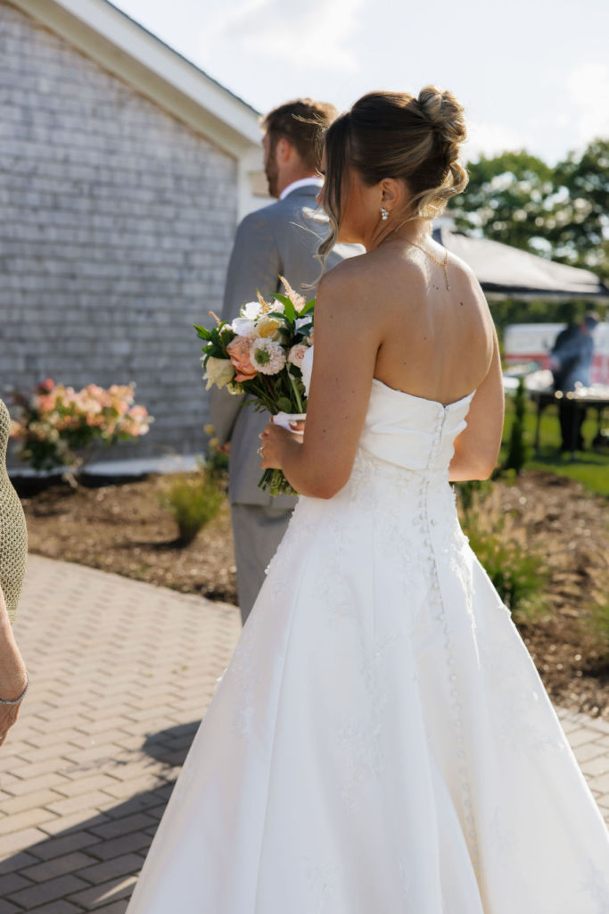 Ash point estate boothbay harbor, bride and groom walk towards ash point estate