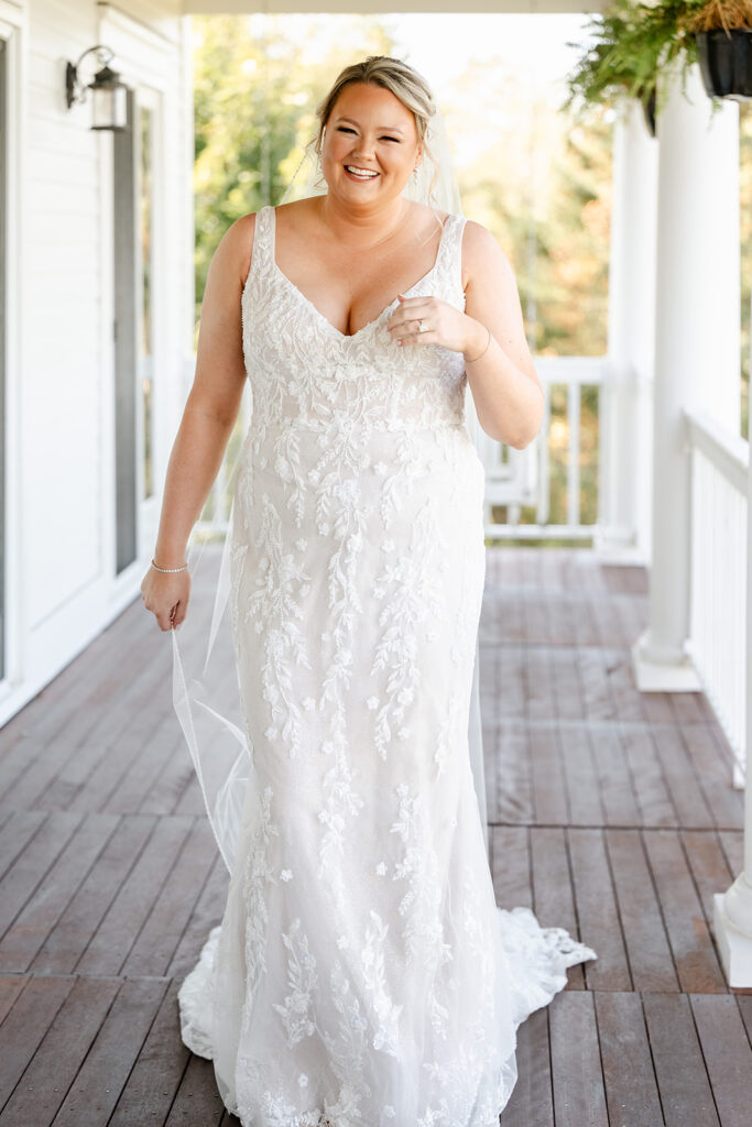 Bride ready for wedding on outside porch at ash point estate