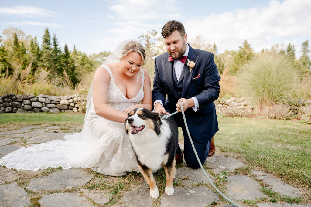 Bride and groom with dog on leash at wedding ceremony at ash point estate