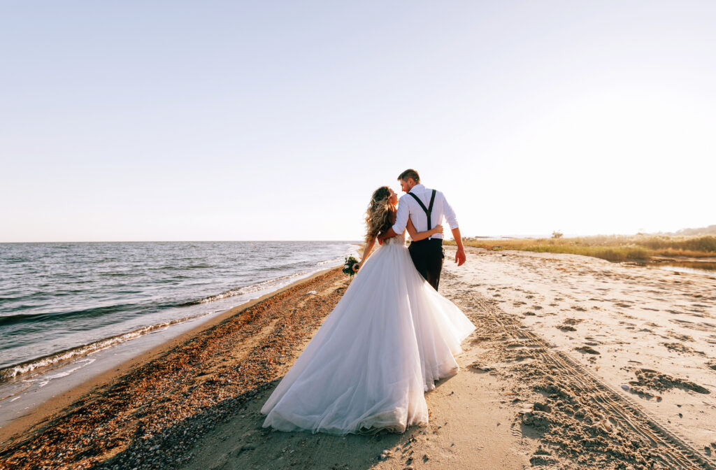 Bride and groom on the seashore. Wedding concept on the sea, on a fabulous island.
